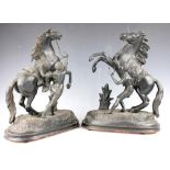 A pair of bronzed spelter models of Marley horses,