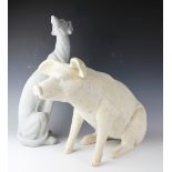 A pair of contemporary decorative figural models, each designed as a seated pig, 39cm high,