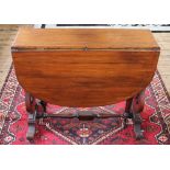 A Victorian mahogany Sutherland table, with turned legs and pierced standard end supports,