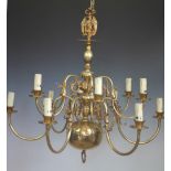 A Dutch style brass twelve branch chandelier, with graduated knopped column support,
