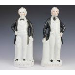 A pair of 19th century Staffordshire figures of Gladstone and Beaconsfield (Disraeli),