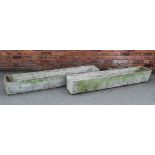 A pair of 20th century fibre concrete planters in the manner of Swiss designer Willy Guhl,
