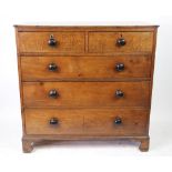 A late 18th century oak chest, of two short and three long drawers, with later bun handles,