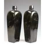 Two 19th century olive green glass gin bottles, each square section bottle of tapering form,