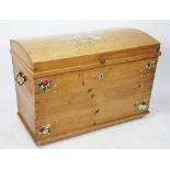 A 19th century pine dome topped chest / coffer, the top and front with floral painted detailing,