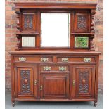 A late Victorian carved walnut sideboard,