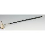 A silver candle snuffer Hampton Utilities, Birmingham 1968, with turned wooden handle, 36.