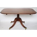 A Regency inlaid mahogany tilt top breakfast table, with a reeded edge,