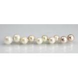 Five pairs of cultured pearl stud earrings, to include a pink hued example, in varying sizes,