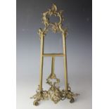 A Louis XV style brass table top easel,