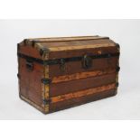 A late 19th century canvas and pine bound dome top trunk,