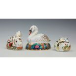 Three Royal Crown Derby paperweights comprising; Swan, Meadow Rabbit and Sleeping Doormouse,