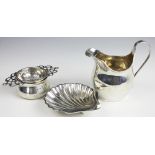 A selection of silver items comprising; A Harrods Ltd cream jug, Richard Woodman Burbridge,