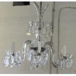 A French glass and crystal chandelier, with six scroll sconce arms and hung with faceted drops,
