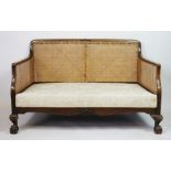 A 1930's stained beech three piece bergere suite, with single caned backs and sides,