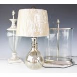 Four assorted table lamps, comprising; an oval straight sided glass and chromed table lamp,