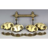 Two sets of four 19th century brass furniture handles,