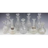 A set of four 19th century faceted glass decanters and stoppers, each 30cm high,