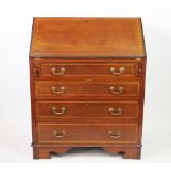 An Edwardian mahogany bureau, with boxwood string inlay, with fall over four graduated drawers,