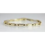 A diamond set yellow metal bracelet,