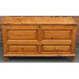 An 18th century style pine mule chest, with hinged lid and two drawers, on stile feet,