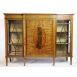 An Edwardian inlaid mahogany low display cabinet, of break-front form,
