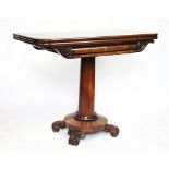A William IV mahogany tea table, with hinged top, on column and platform with scroll feet,