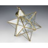A contemporary star form glass light fitting,