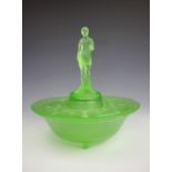 An Art Deco green glass table centre, with a figure of a nude to the centre,