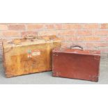 A tan leather suit case, with Cunard Line vintage labels, 21cm H x 70cm W x 41cm D,