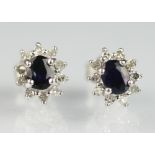 A pair of sapphire and diamond cluster stud earrings,
