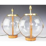 A pair of contemporary clear glass and leather and buckle effect strap table lamps,