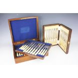 A late Victorian canteen of eighteen pairs of plated dessert knives and forks,