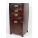 A Chinese stained wood bedside chest, of three drawers and cupboard door, on block feet,