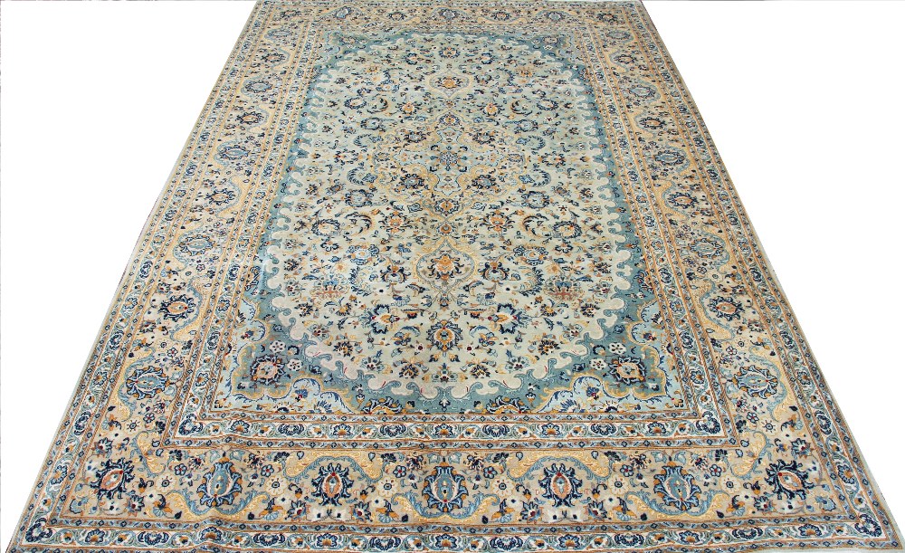 A hand woven wool Persian Kashan carpet,