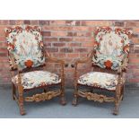 A pair of 17th century style carved beech arm chairs,
