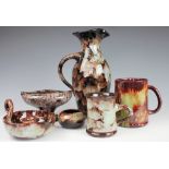 A selection of Welsh Ewenny pottery, each piece with a mottled glaze, comprising; a water ewer,