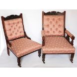 A pair of Victorian carved walnut library chairs, with upholstered backs, arms and seats,