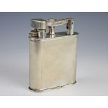 A Dunhill silver plated table lighter, of large proportions, with engine turned detailing,