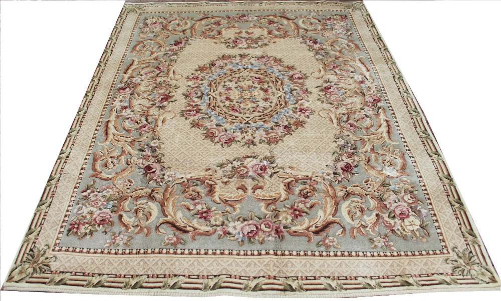 A Chinese hand woven carpet, with floral Aubusson style detailing,