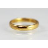 A 22ct yellow gold wedding band, size L, weight 3.