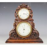 A Victorian carved oak combination time piece and aneroid barometer,