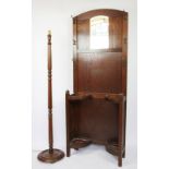 A 1920's oak hall stand, 182cm, with a standard lamp,