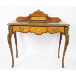 A French Louis XV style inlaid walnut serpentine writing table, with two drawers, on cabriole legs,