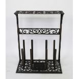 A cast iron combination boot scrape / Wellington boot rack, with scroll detailing,
