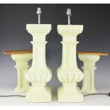 A pair of green painted terracotta table lamps,