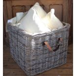 A pale wicker log basket, the square form basket with two leather style handles,
