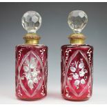 A pair of 19th century Bohemian cut glass ruby flashed decanters and stoppers,