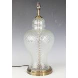 A Regency style glass table lamp, with moulded trellis detailing and brushed brass effect fittings,