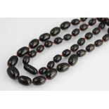 A black amber bead necklace,